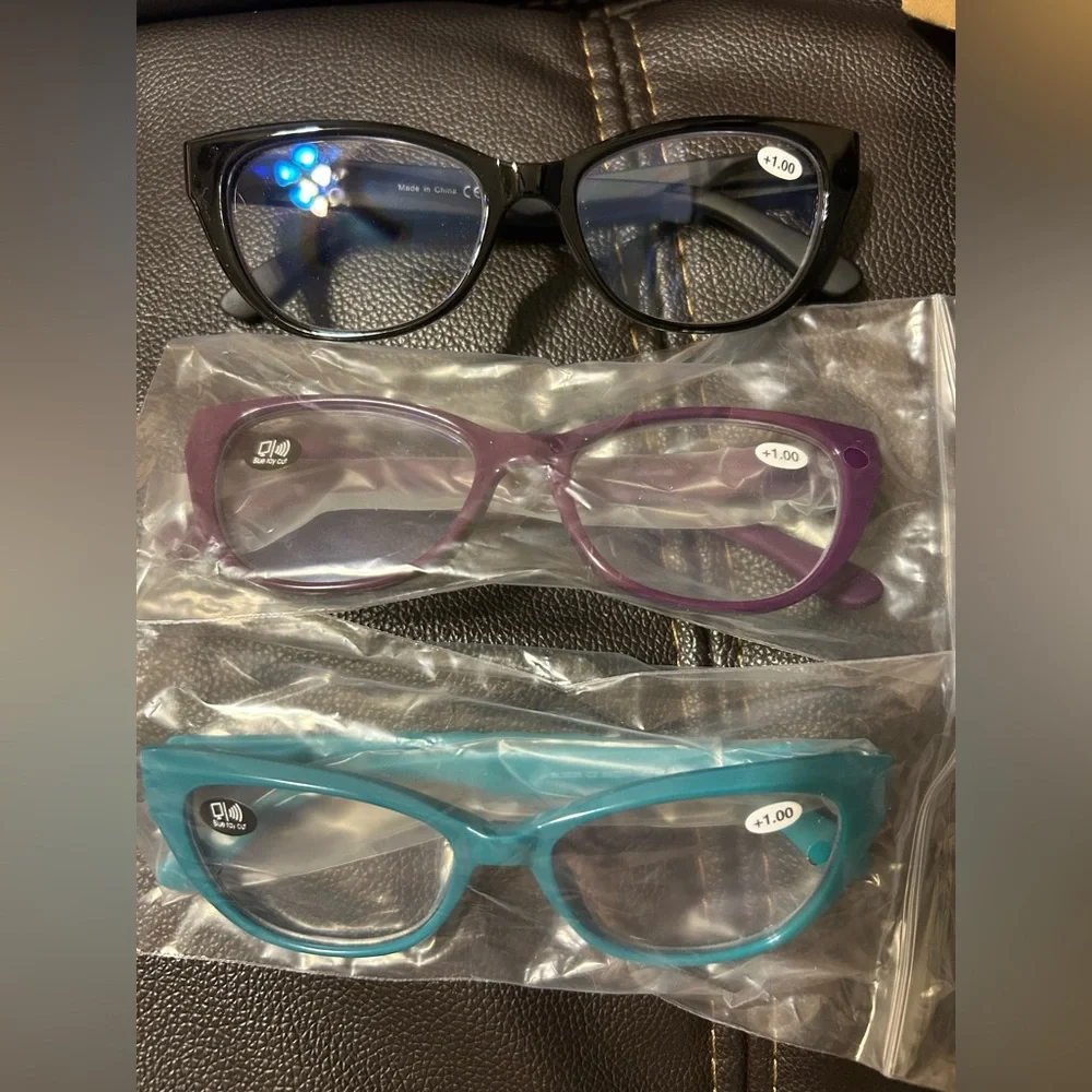 Reading glasses. 1.00.‎ Black, Teal and Purple. Brand new, in box.